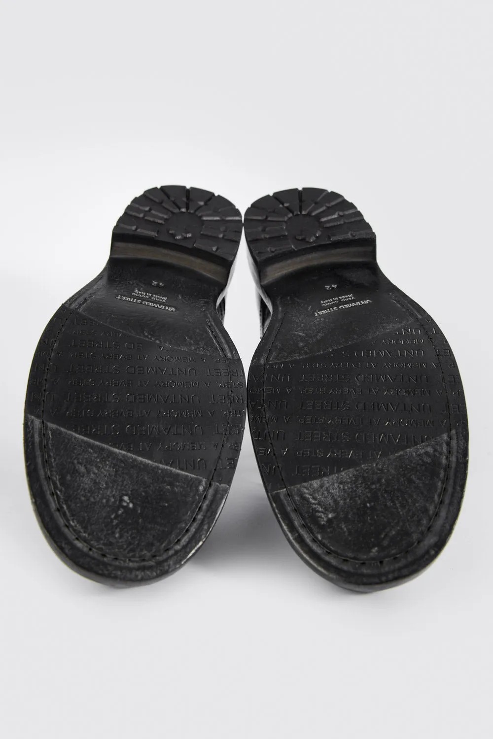 CURZON jet-black military boots.