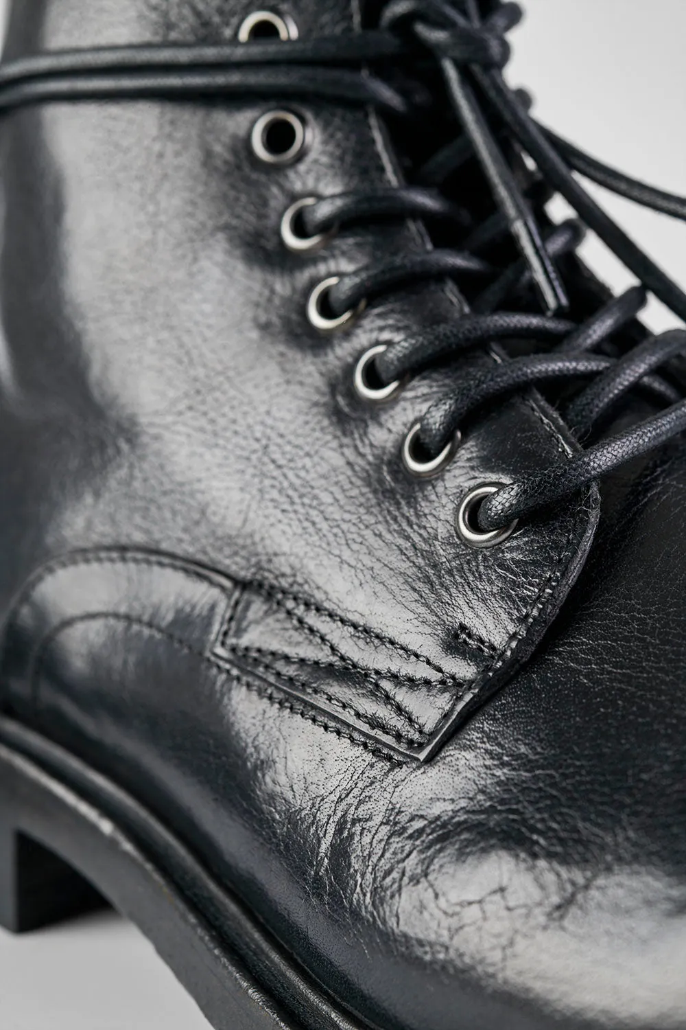 CURZON jet-black military boots.