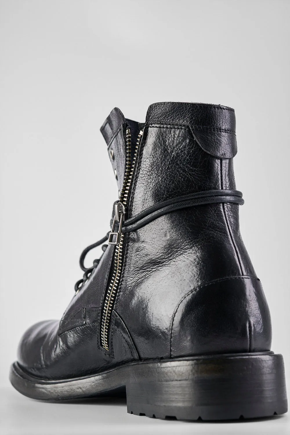 CURZON jet-black military boots.