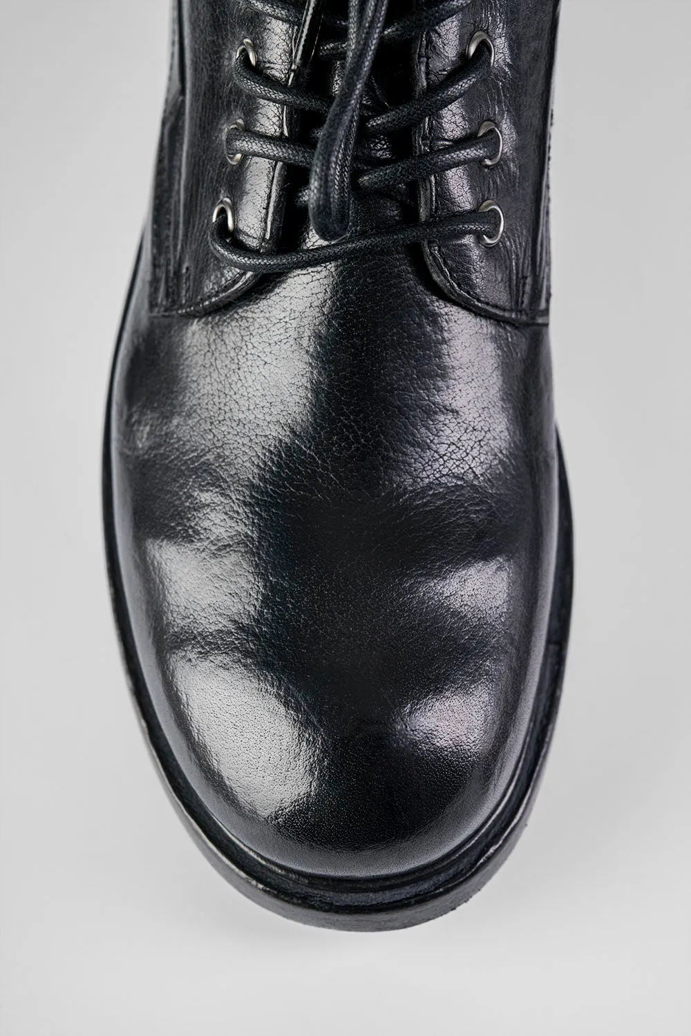 CURZON jet-black military boots.