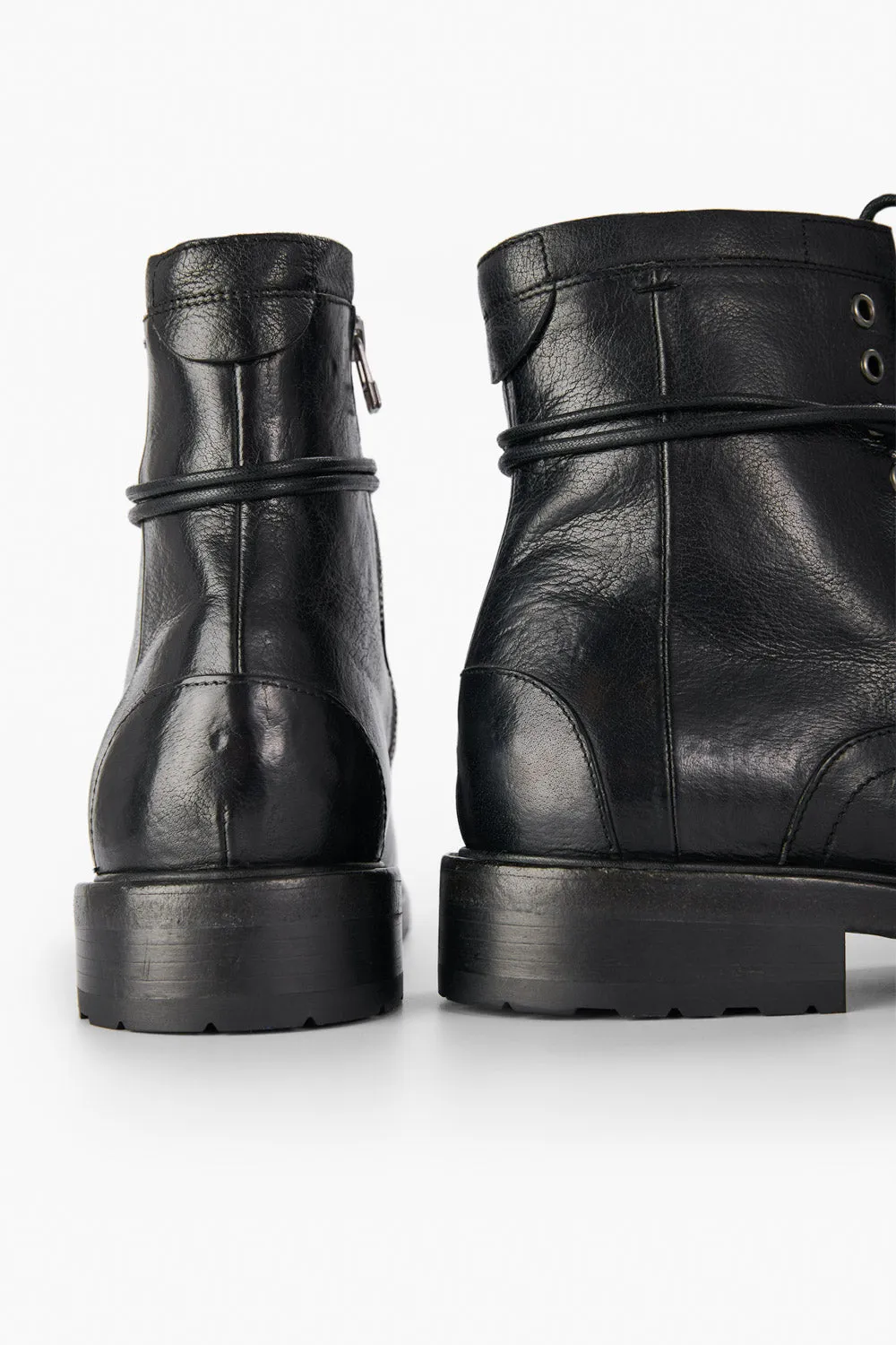 CURZON jet-black military boots.