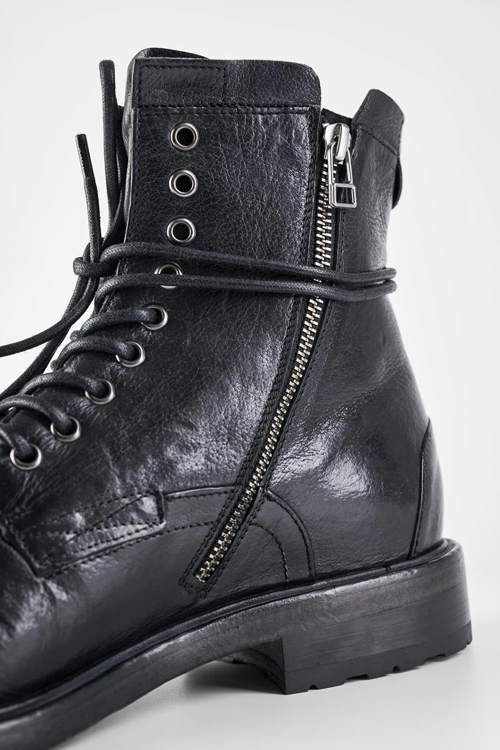 CURZON jet-black military boots.