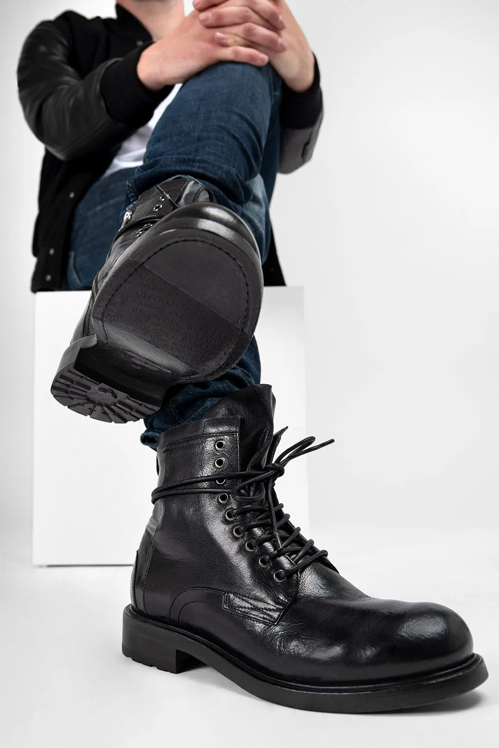 CURZON jet-black military boots.